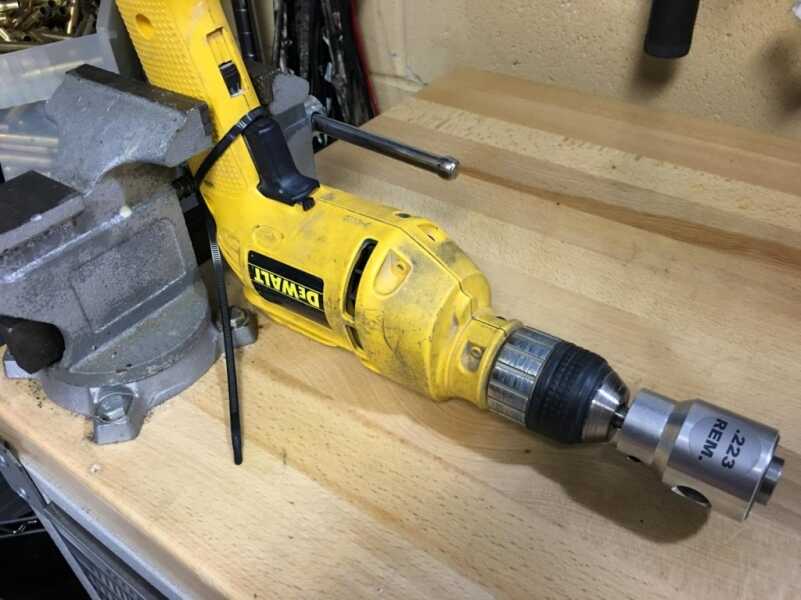 Reloading: Trimming Cartridge Cases Feel free to go full redneck and set up something like this for hands free operation of the drill. Note the zip tie on the trigger. That's probably not OSHA approved...