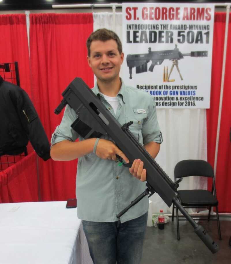 The St. George Arms .50 BMG Bullpup in the Flesh -- NRA 2016 One of the kind gentleman at the booth. You can see just how portable it is.