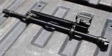 The barrel, with rail attached. This method of mounting the rail gives more stability than you would get from mounting the rail to the polymer parts.