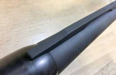 The barrel is topped with a plan flat black rib.