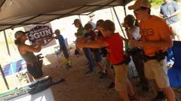 Kids And Guns: Teach Your Children Well Lena Miculek, instructing juniors on the finer points of how to properly grip a pistol.
