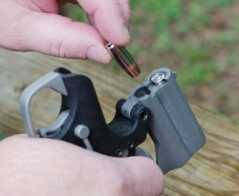 The Backup employs a top-hinging barrel system and dual barrels. The author is shown here loading it with 9mm.