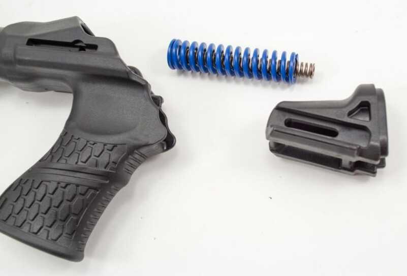 Most of the recoil reduction magic happens here. The top slide and stock are separated by dual recoil springs which slow down the impulse. 
