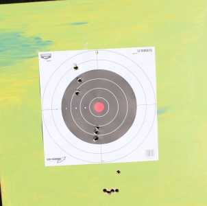 Traditions Muzzleloaders—Two Gun Review, Pursuit G4 and Buckstalker Final target. First 3 from the Buckstalker are high and to the left. Second 3 after a little adjustment to scope are good on windage but a bit low. The 4 toughing and the one floater at the bottom are from the Pursuit right out of the box. These were from 100 yards.