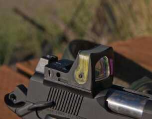 A 100-Yard 1911: Republic Forge Longslide 10mm—Full Test Republic Forge can cut the slide to accept optics such as this Trijicon RMR. Note the tall rear sight unit behind it.