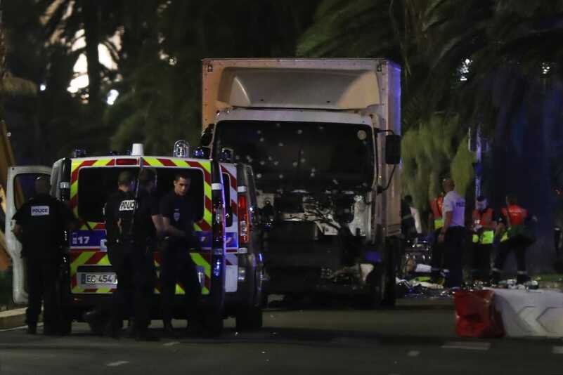 Bastille Day Celebration Turns to Massacre in Devastating Truck Attack Police officers and rescued workers stand near a van that ploughed into a crowd leaving a fireworks display in the French Riviera town of Nice on July 14, 2016. The mayor of the French city of Nice said dozens of people were likely killed after a van rammed into a crowd marking Bastille Day in the French Riviera resort today and urged residents to stay indoors. / AFP PHOTO / VALERY HACHEVALERY HACHE/AFP/Getty Images