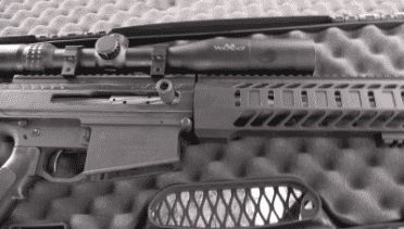 Long Range Assassin is .30-06 Semi-Auto AR-15 - Noreen BN36 It has a big heavy custom made bolt, and the gun is side charging, without any silly cocking ears.