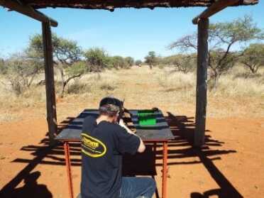 Blood In The Bushveld: A Father And Son On Their First Safari in South Africa The author's son is shown here sighting in a Sako .270 Win. rifle before heading out into the wild.