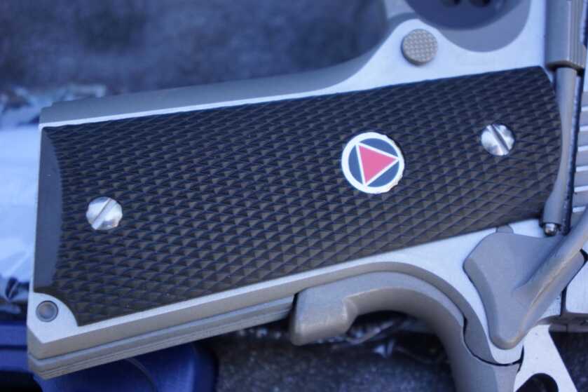 Colt Delta Elite 10mm synthetic grip panel with the classic Delta medallion
