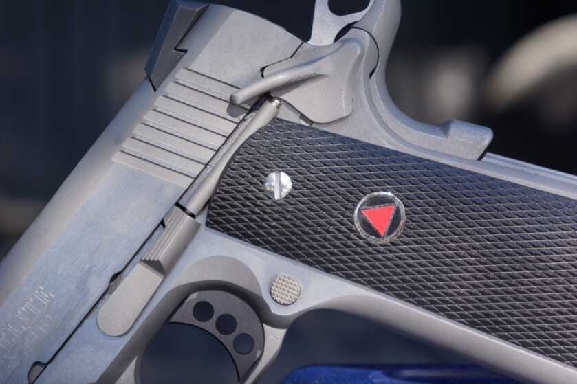Colt Delta Elite 10mm controls showing the familiar 1911 thumb safety slide stop and magazine release