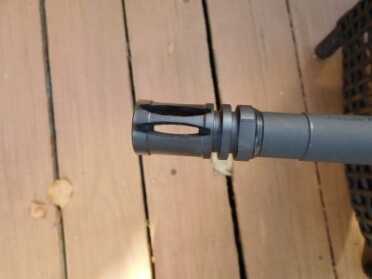 The MMR sports a typical AR-pattern birdcage flash suppressor because it works.