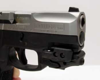A small section of Picatinny standard rail is molded into the frame. Small lasers, like this Crimson Trace Rail Master, can be attached to the rail. Massive scallops on the slide save weight and improve the look of pistol.