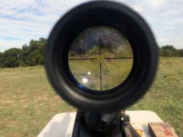 New FFL Form 4473 for Background Checks Incoming The plywood target you see to the right of the reticle is 100 yards away with the scope set to 9X. The picture doesn’t do the scope justice, but you get the idea.
