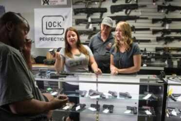 California SNAFU: Prop. 63 Proves to be Nightmare for Gun Shops, Ammo Dealers At the Get Loaded gun store in Grand Terrace, store managers Jamie Taflinger, left, and Kendyll Murray show customer Cornell Hall of Highland different types of ammo. (Gina Ferazzi / Los Angeles Times)