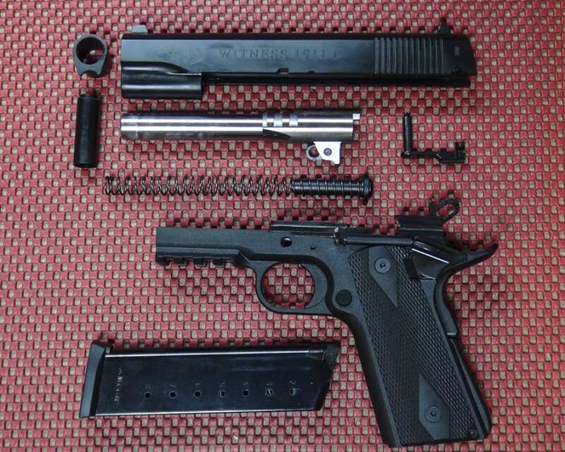 A Plastic 1911? The EAA Witness 1911P .45 ACP—Full Review. The basic design is GI, with a few 'extras' such as a tac rail, lightened hammer, and enhanced grip safety. The guide rod and plug are also polymer.