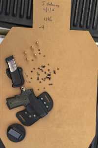 Target and gear used in qualification. The holster is a Concealment Solutions unit and the magazine pouch is from DeSantis. 
