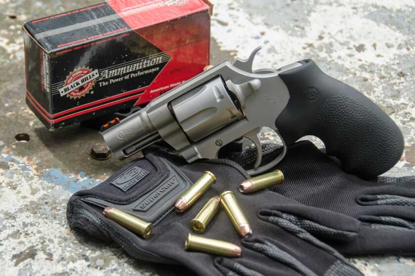 Author handling the stainless Colt Cobra after range testing the compact .38 Special revolver