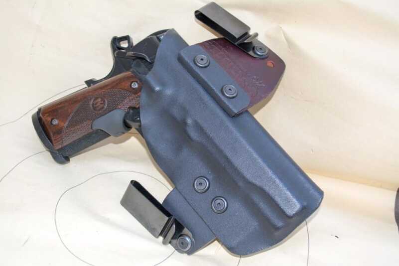 I use the No Print Wonder to carry this Springfield Armory 1911 TRP. It tucks the large grip in amazingly well thanks to the leather hinge on the front belt clip.