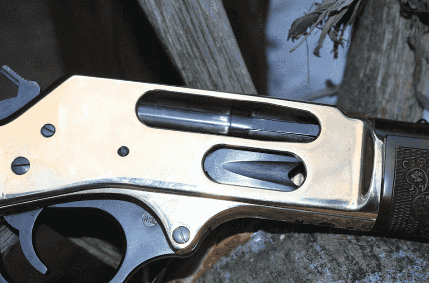 Henry .45-70 brass receiver detail on the side gate lever action rifle