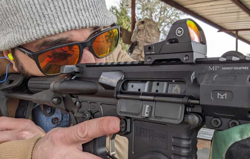 Target showing initial impacts while getting a red dot sight on paper before final zero adjustments