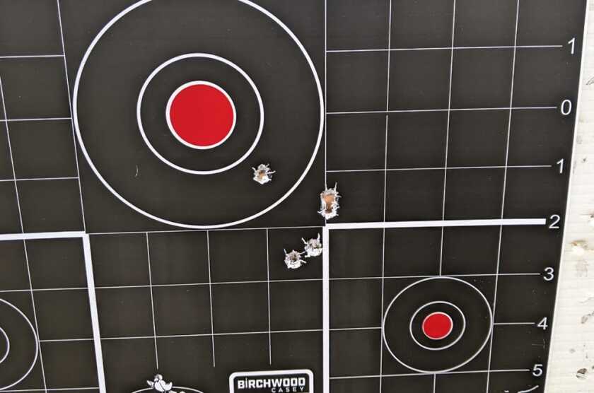 Multi-shot target group used to calculate red dot sight adjustments at the desired zero distance