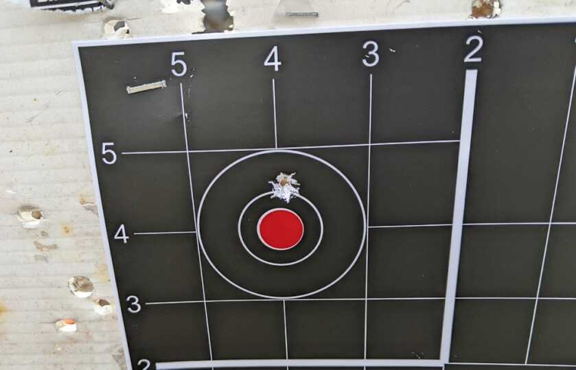 Five-shot group on a paper target used to verify and refine a red dot zero