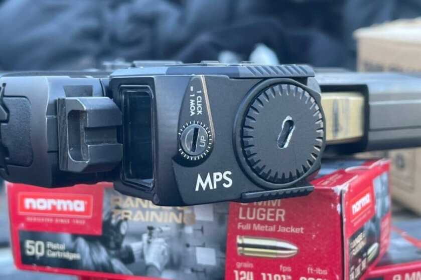 Steiner MPS: Enclosed-Emitter Micro Pistol Sight Review Steiner MPS mounted on pistol sitting on a box of Norma ammunition