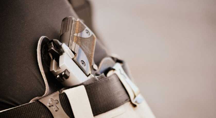 Holstered pistol.