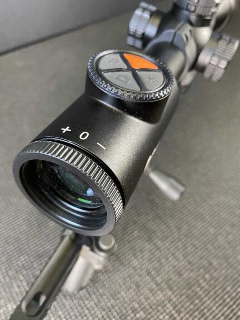 Top control pad on the InfiRay BOLT TH50C with power, brightness, camera, and thermal palette controls