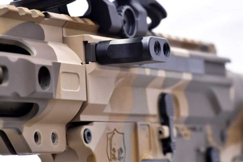 The Civilian Defensive Rifle is side charging and is superior to traditional AR-15 charging handles.