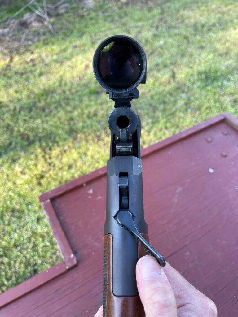 Top shot of a single shot rifle broken open to load
