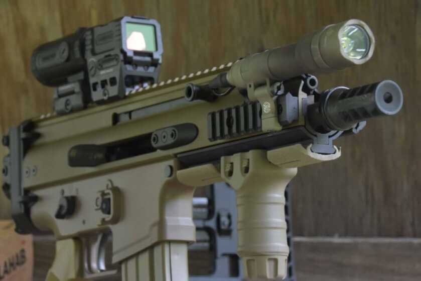 Front view of FN SCAR 15P with TangoDown grip, rail covers, and Surefire weapon light