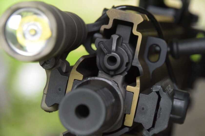 FN SCAR 15P gas block showing suppressed and unsuppressed gas settings