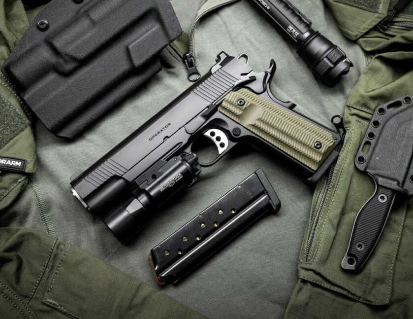 A Springfield Armory Operator 1911, equipped with a flashlight.