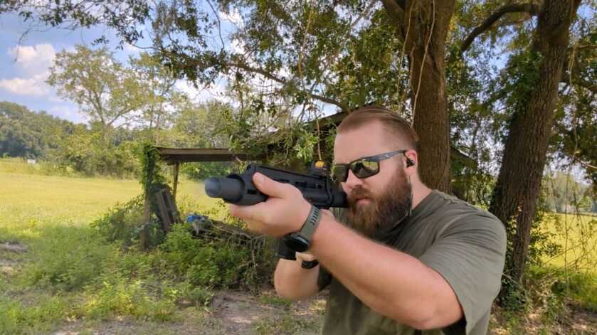 The Extar EP45 - Big Bore Subgun Shooter using the Extar EP45 outside in the shade of a tree