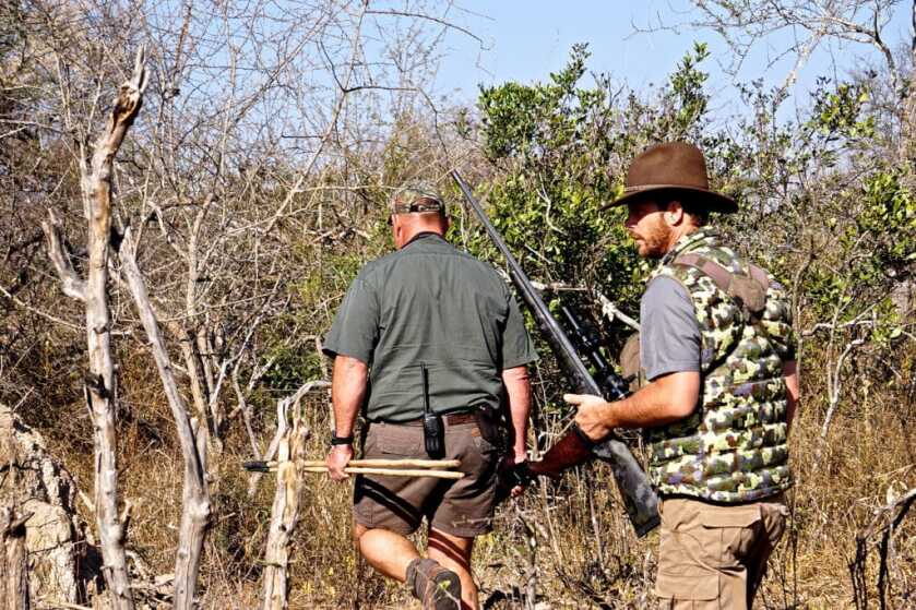 Hunt365 - TAKE THE SHOT: Monster Cape Buffalo Hunters trekking through thick vegetation looking for buffalo