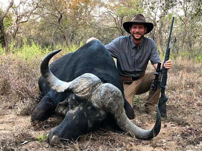 Hunt365 - TAKE THE SHOT: Monster Cape Buffalo Hunter with his Bergara Canyon rifle and a massive buffalo