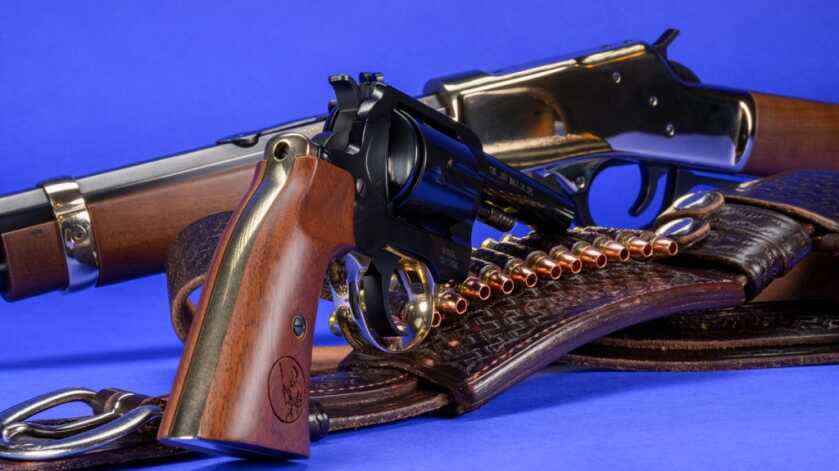 Henry Big Boy Revolver Review Henry Big Boy Revolver beside a Henry carbine and traditional leather gun belt