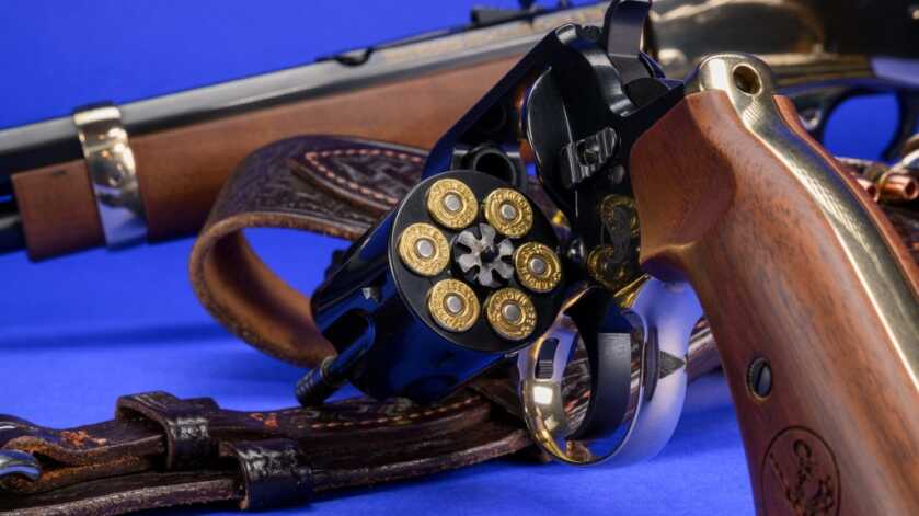 Henry Big Boy Revolver Review Henry Big Boy .357 Magnum revolver with its cylinder open and a Henry carbine in the background