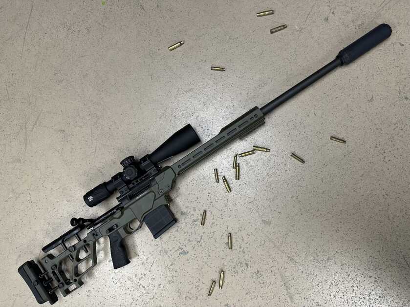 From Factory to Field: Competition-Oriented Daniel Defense Delta 5 Pro Reviewed A HuxWRX suppressor and Zero Compromise optic are mounted on the Delta 5 Pro that is laying on the concrete floor, cartridge casings laying all around it.