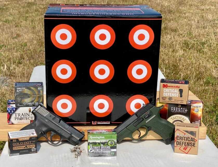 An assortment of self-defense ammunition with two pistols and a "Intruder In a Box" set