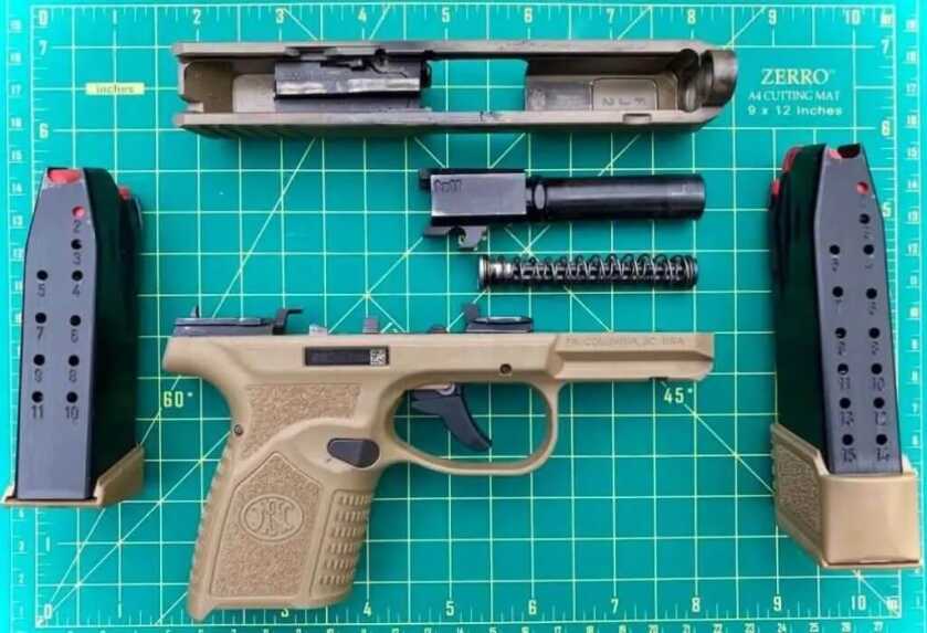 FN Reflex 9mm micro compact field stripped to show its internal hammer-fired design