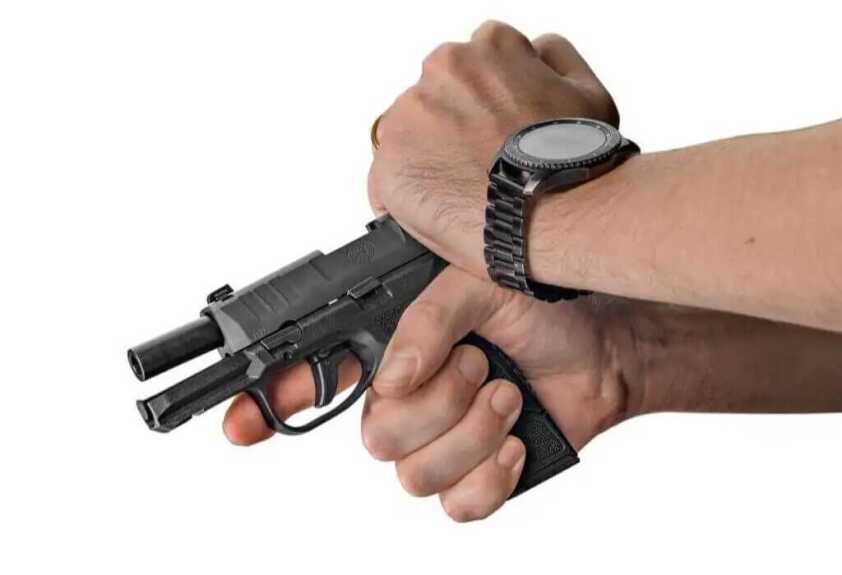 Racking the slide on the FN Reflex micro compact 9mm before range testing