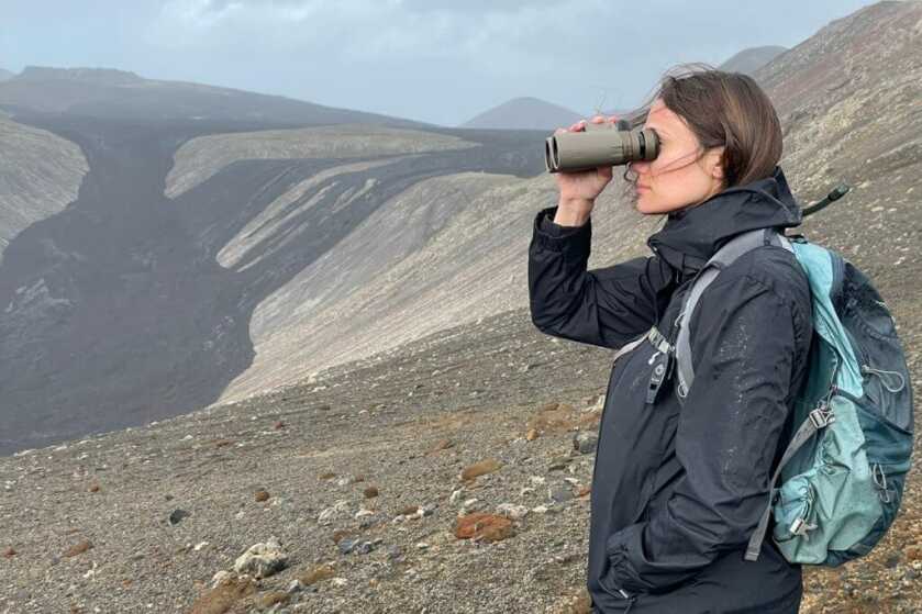 2 - Nature Observation: Sig ZULU8 HDX 10x42 Binocular Review Woman looking out at lava flows through Sig Sauer binoculars