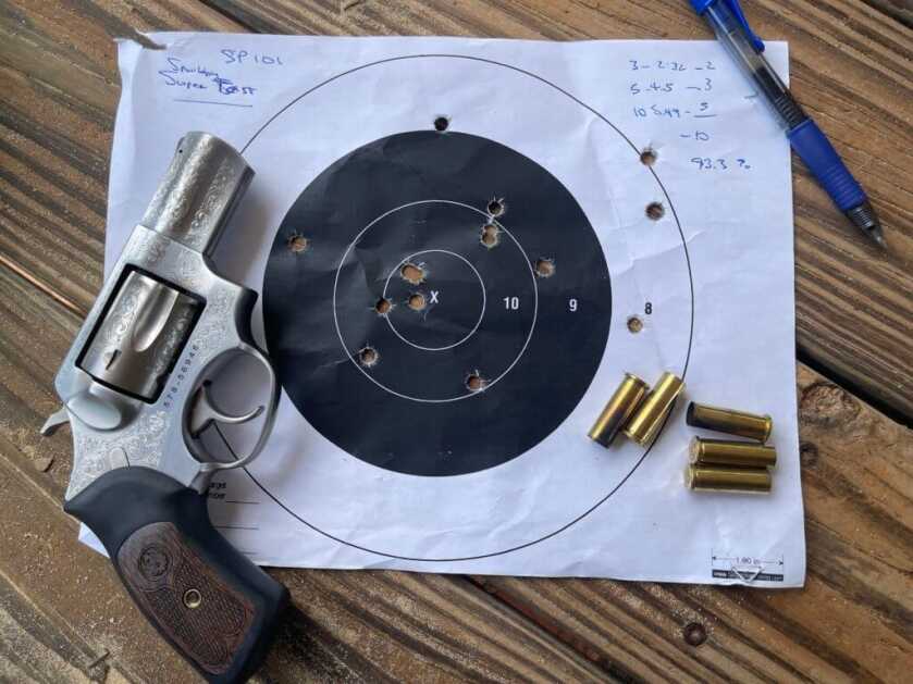 Ruger’s Classy SP101 TALO Special The SP101 with a used target and brass casings on a wooden table