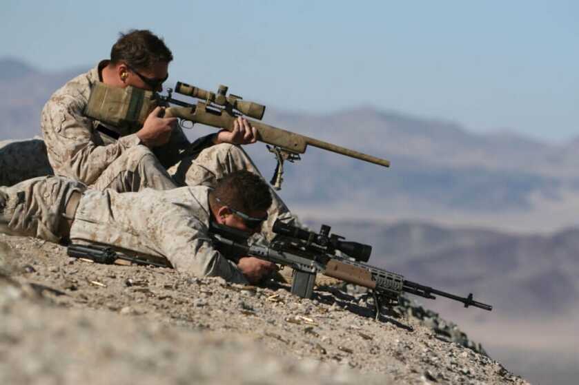 3 - The Best Modern Combat Proven Handguns, Shotguns, and Rifles United States Marine Corps troops shooting guns on rock