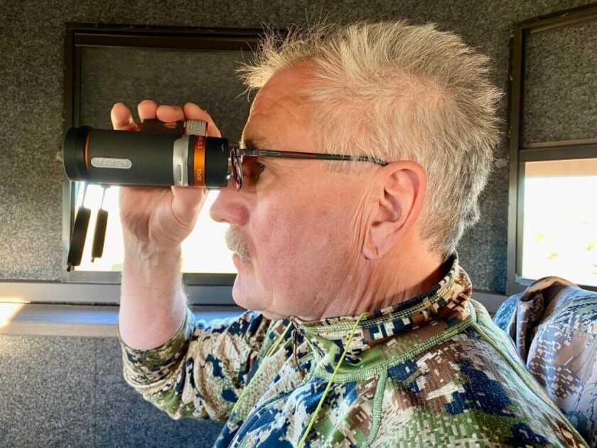 3 -- Go Small or Go Home! Maven’s Compact B.3 Binoculars Are Superstars Man looking through Maven B.3 binoculars