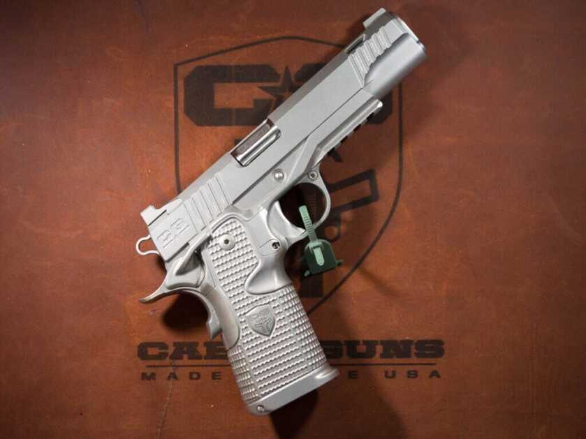 The right side of the Cabot Insurrection 2011. The gun is positioned diagonally pointing to the top right with the right side up. It is finished in bead blasted matte stainless.