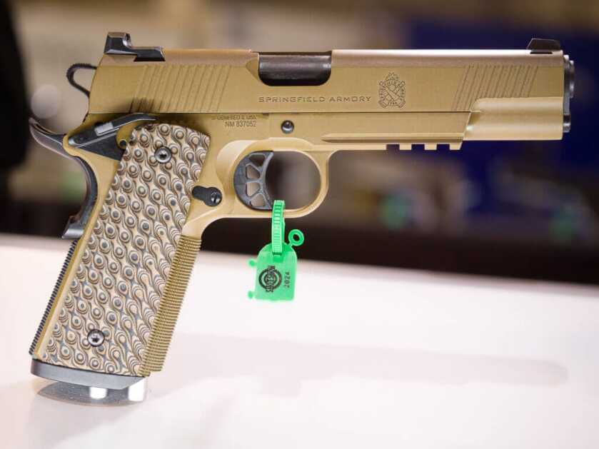 Photo of the entire gun, the gun is pointing right. It's is coyote brown.