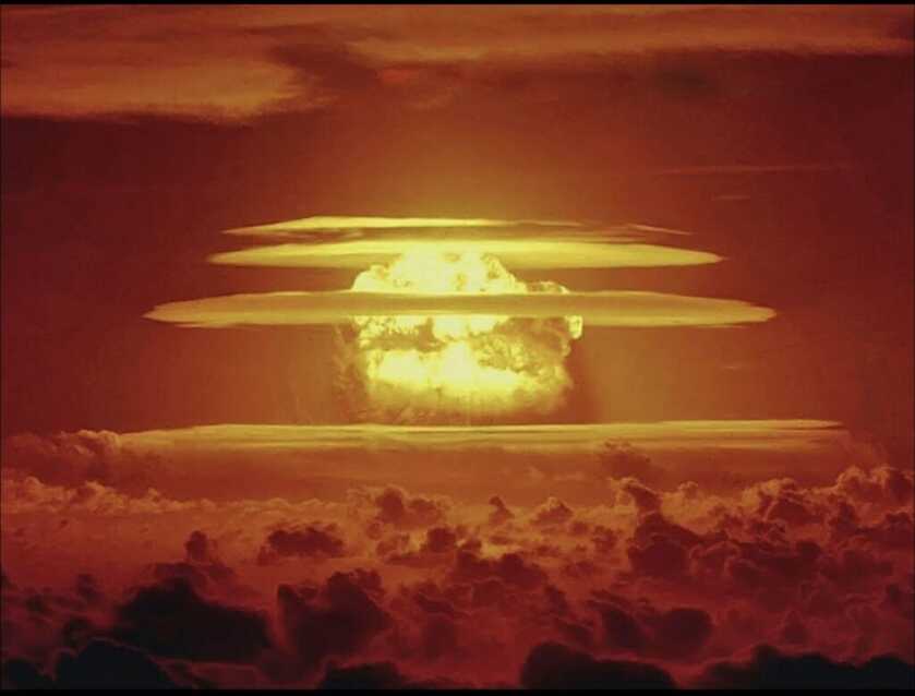 Nuclear Cloud in an orange sky above clouds